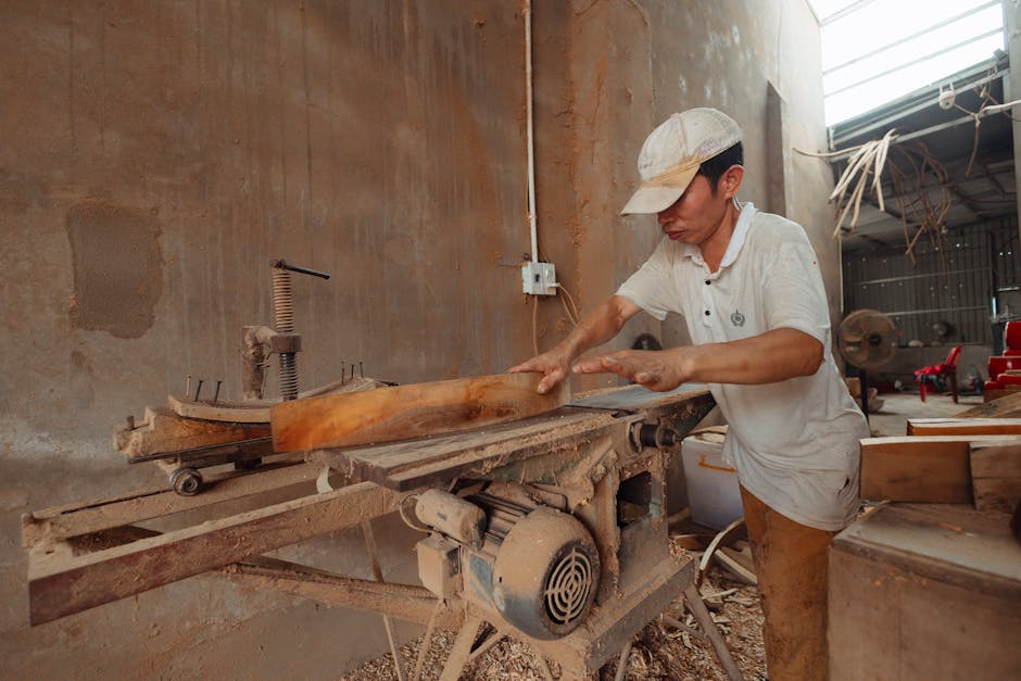 Master woodworker crafting custom furniture in a modern workshop